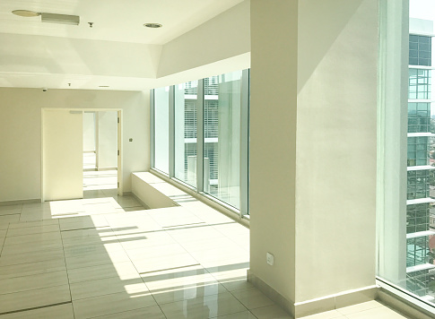 Empty corridor in modern office building. Copy space.