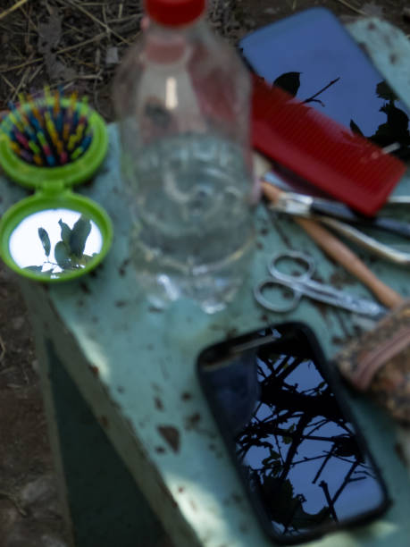Phones and mirror, reflecting sky