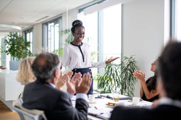 istock Business Colleagues Applauding Successful Presentation 1329123342