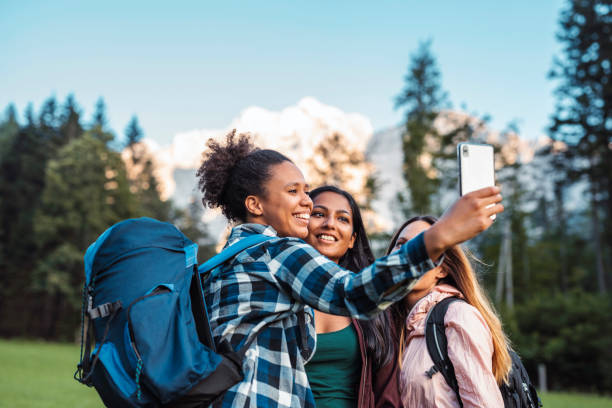 istock Multi-Ethnic Female Friends Taking Selfie on Day Hike 1329123389