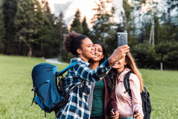 istock Multi-Ethnic Female Friends Taking Selfie on Day Hike 1329123393