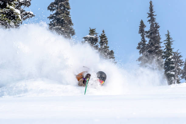 istock Backcountry skier descends through dense powder 1329128236