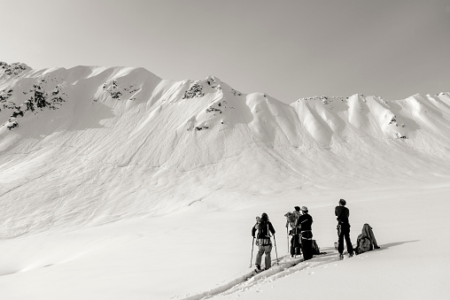 a group of people skiing in the French Alps