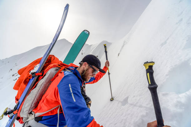 istock Backcountry skier climbs steep snow slope 1329128796