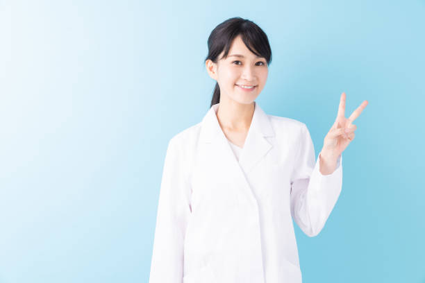 istock attractive asian woman in a white coat 1329131263