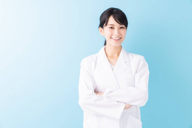 istock attractive asian woman in a white coat 1329131274