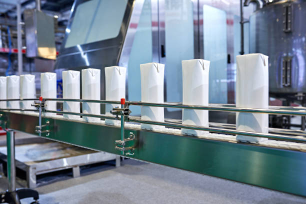 Side view of blank milk carton at production line.