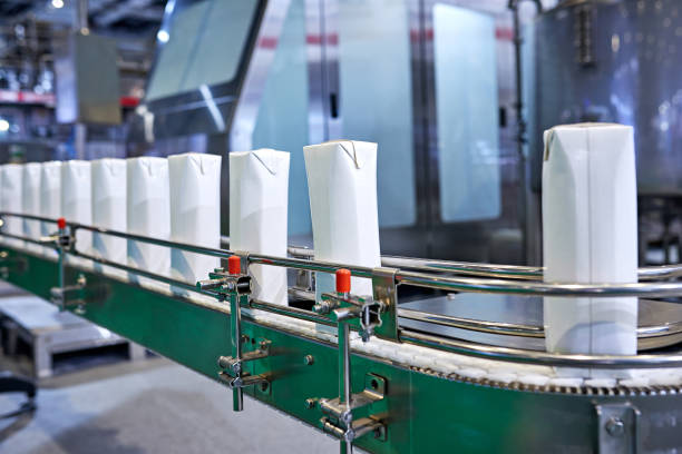 istock Blank Milk Carton at Production Line 1329135536