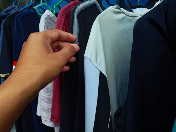 istock a man's hand holding a clothesline 1329144787