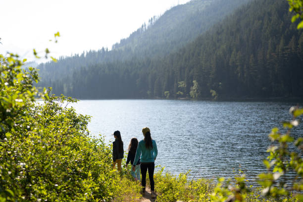 istock Family hiking along a lake 1329146686