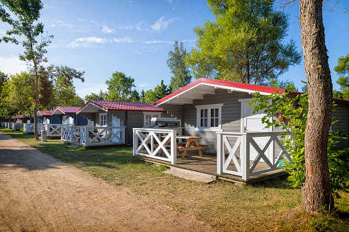 Holiday in Poland - Colorful, swedish style cabin houses in a summer day