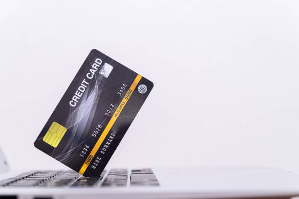 istock Credit card with computer Used in online shopping 1329152895