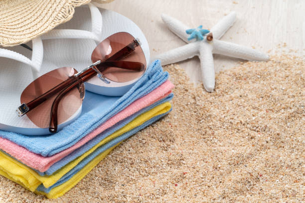 istock Summer beach background design concept with accessories on white table background. 1329153034