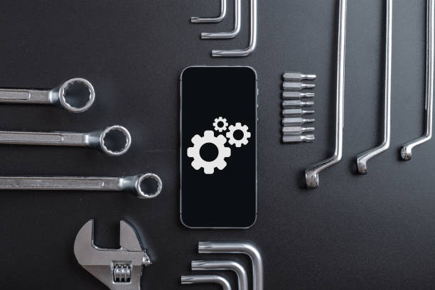 istock Mobile repair service. Technician workplace with phone and special repairing tools. Electronics repair service, device production concept. 1329153840