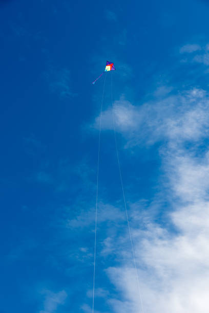 istock Colorful Kites flying over the sky 1329159104