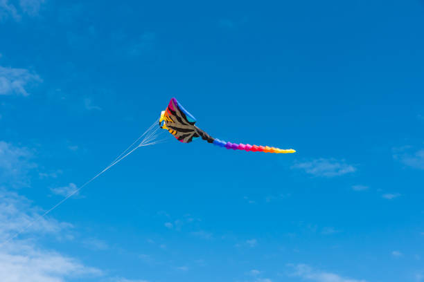 istock Colorful Kites flying over the sky 1329159154