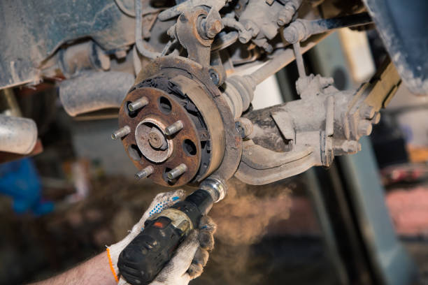 istock Gloved hands use a power tool to clean the rust on the rear wheel hub 1329163707