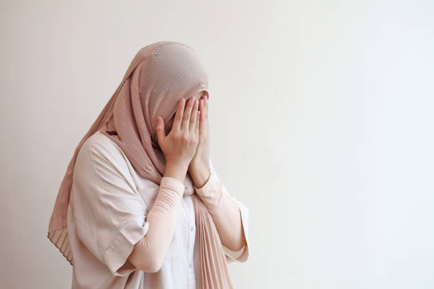 istock Muslim woman praying for god during work from home. 1329174178