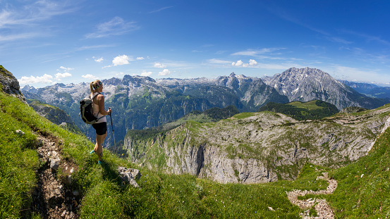 Athletic Woman hiking at the Nationalpark Berchtesgaden Mountains, Germany