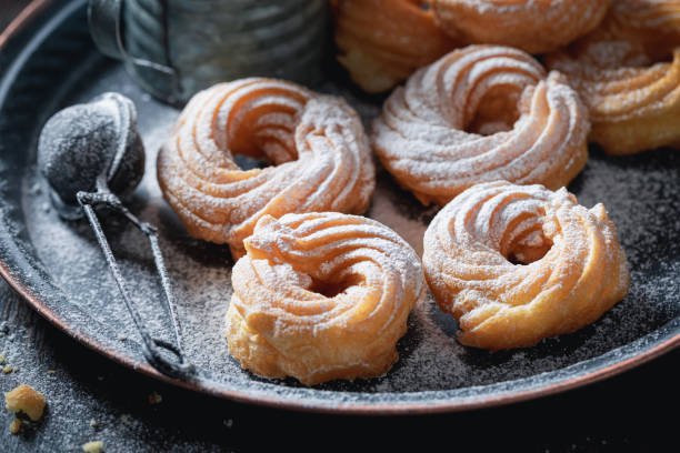 istock Sweet spanish donuts with sparkling sugar. Donuts easy to make. 1329179382