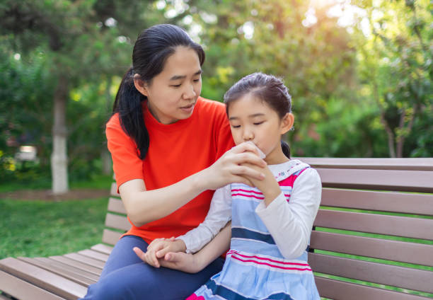 istock Little Girl and Mother Drinking Yogurt 1329184508