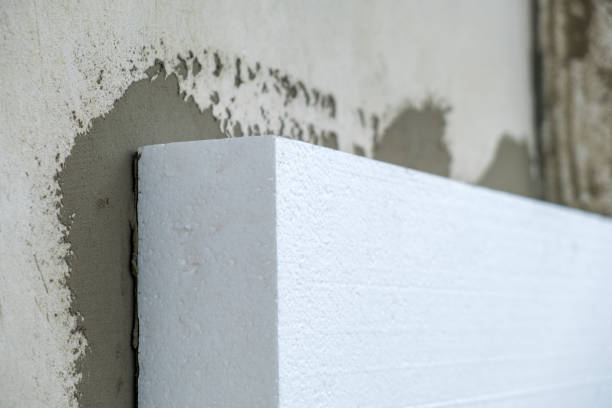 istock Installation of styrofoam insulation sheets on house facade wall for thermal protection. 1329185302
