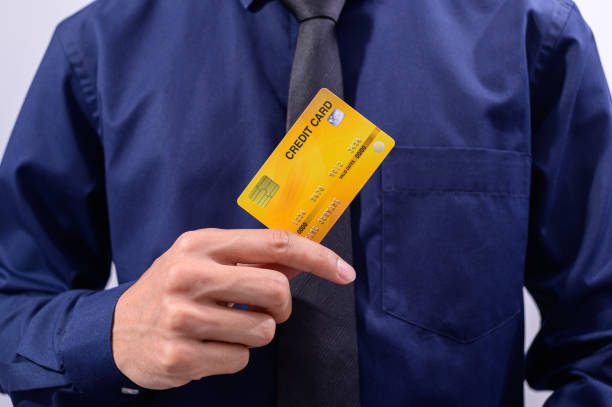 istock Business people hold credit cards 1329188482