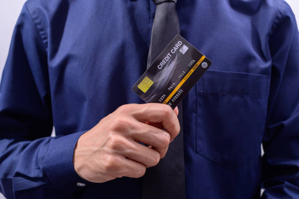 istock Business people hold credit cards 1329188635