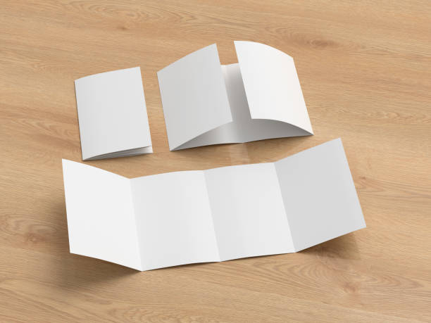 istock Vertical double gate fold brochure. Four panels, eight pages blank leaflet. Mock up on wooden background for presentation design. Folded, semi-folded and front side. 1329194534