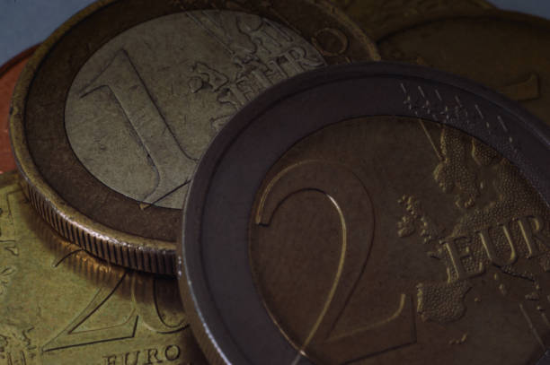 istock Macro one euro and two euros coins 1329195465
