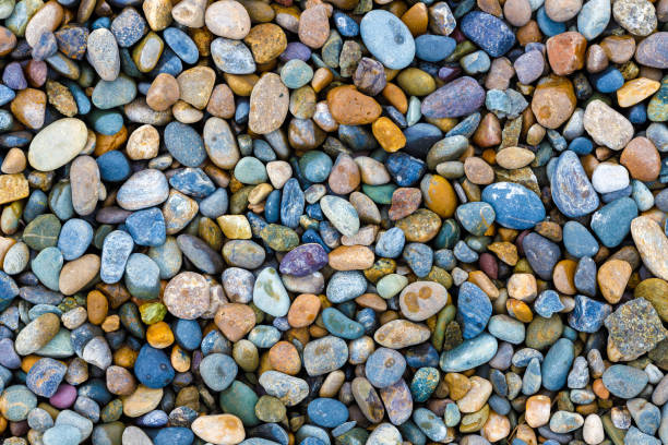istock These are wet river pebbles and small round pebbles. Solid background. Top view. Building material or decoration 1329195634