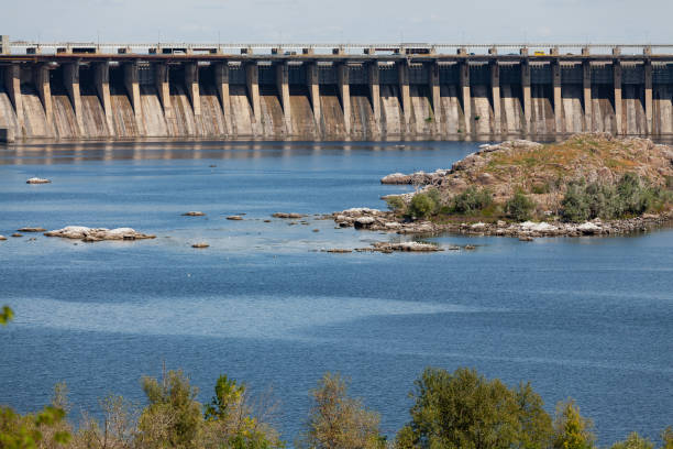 Industrial landscape. Powerful concrete dam blocks river