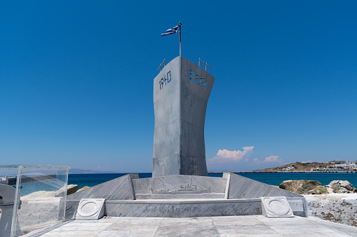 Tinos, Greece - June 11 2021: Elli's Monument at Tinos port in memory of the famous warship