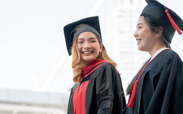 istock Two asian women happy with graduation 1329202516