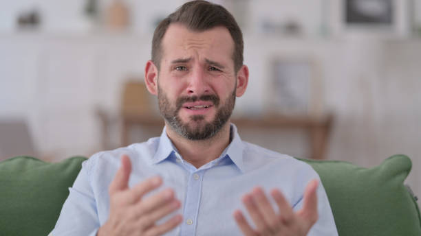 istock Young Man having Loss at Home 1329204900