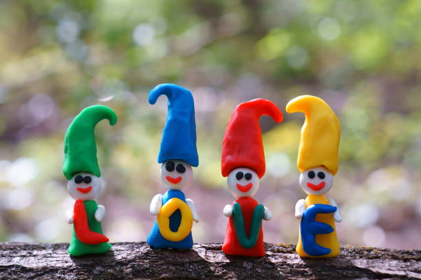 istock Figures of colorful dwarfs on a colored background. 1329205882