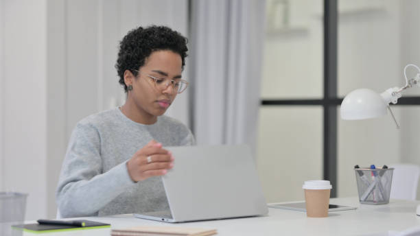 istock African Woman Closing Laptop Going Away 1329206029