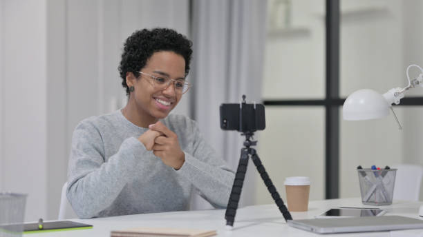 istock Video Recording on Smartphone by African Woman 1329206178