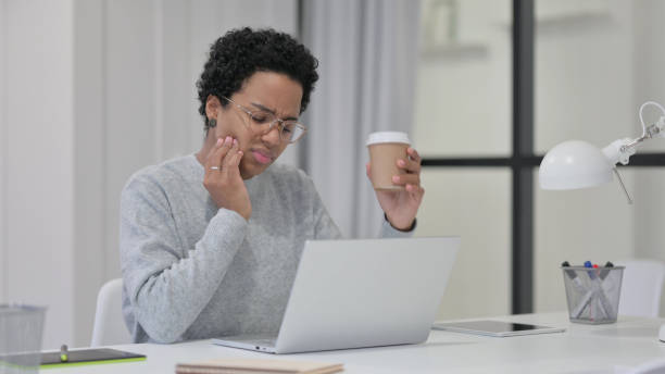 istock African Woman having Toothache While Drinking Coffee 1329206216