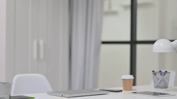 istock Creative Minimalist office with Closed Laptop on Desk 1329207094