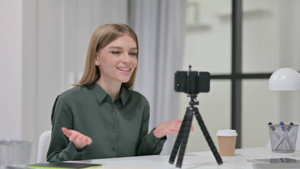 istock Video Talk on Smartphone by Young Woman 1329207169