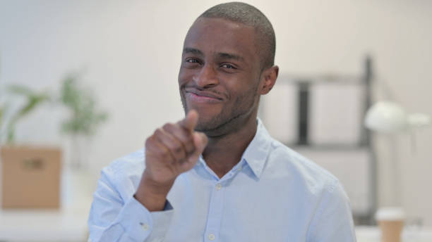 istock Portrait of African Man Pointing at Camera 1329207301