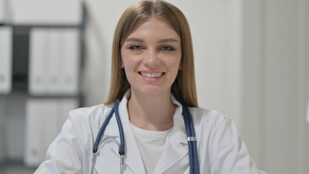 istock Female Doctor Smiling at Camera 1329207523