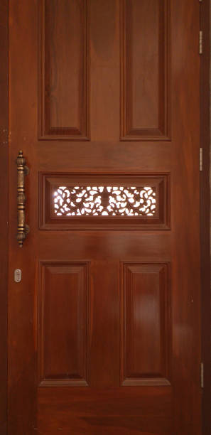 istock Teak wood door with engravings 1329207910