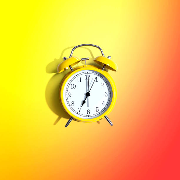 istock Yellow vintage alarm clock with shadow 1329209873