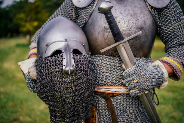 Medieval warrior with chain mail armor Medieval warrior with chain mail armor and sword chain mail stock pictures, royalty-free photos & images