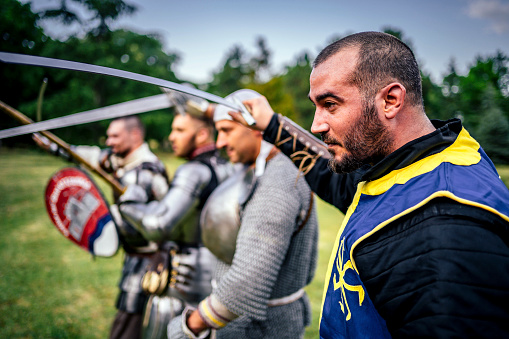 Fighting medieval knights in armor in nature