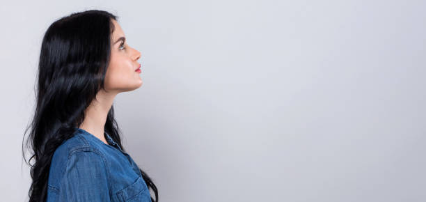istock Young woman profile shot 1329213965