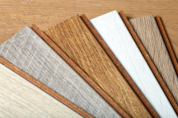 istock Laminate background. Samples of laminate or parquet with a pattern and wood texture for flooring and interior design. Production of wooden floors. 1329218163
