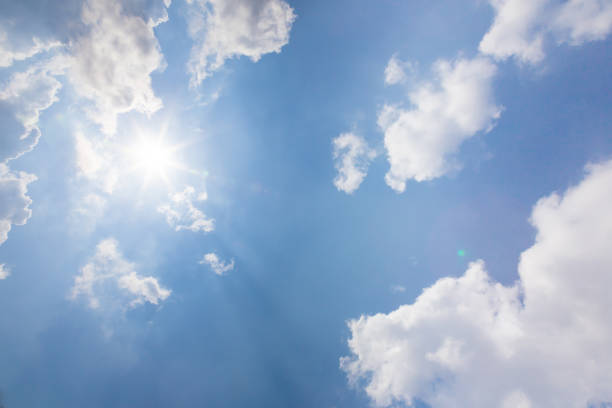 istock Beautiful light blue sky with cloud for background. the Cumulus cloud with the sun in midday. 1329219155